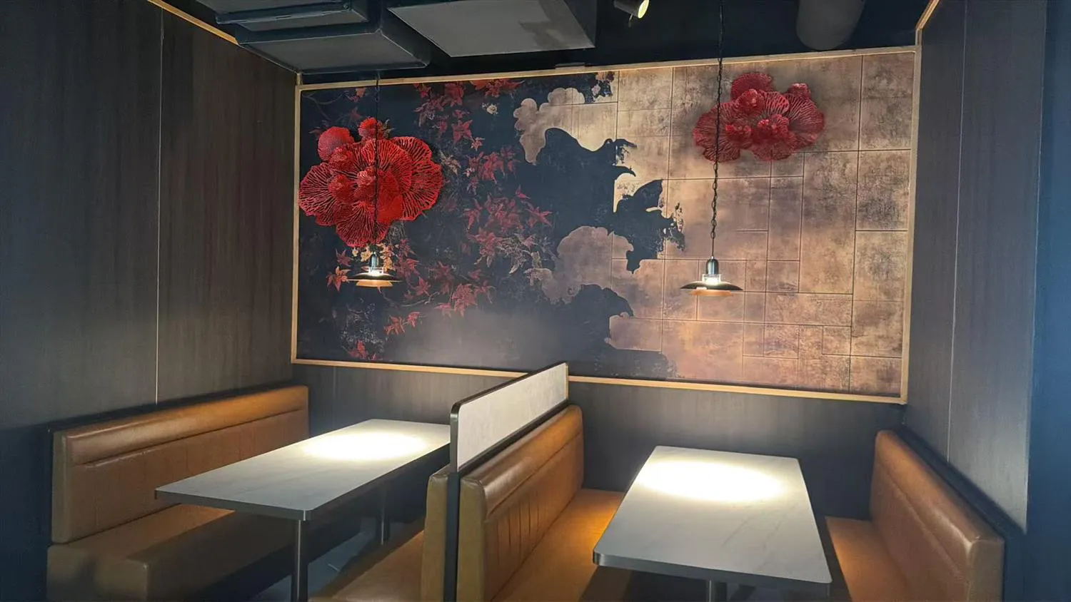 Restaurant dining area with booth seating and a red floral mural at Akiyo, a Japanese Restaurant in Johnson City